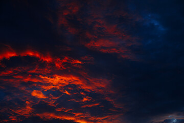 Fototapeta na wymiar Dramatic red clouds during sunset.
