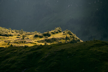 Spotlight of sunlight on a small cliff in the hills of Sabbia Valley, Northern Italy