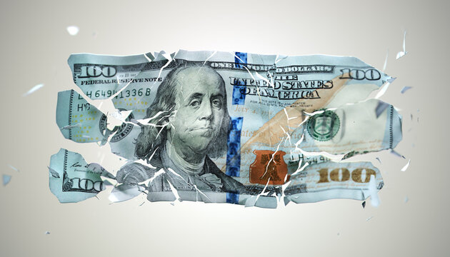 Broken US paper money on a grey background