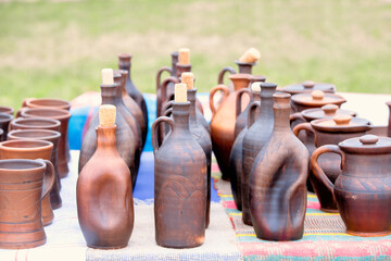 Ethnic ceramic goblets and vessels for wine at the fair.
