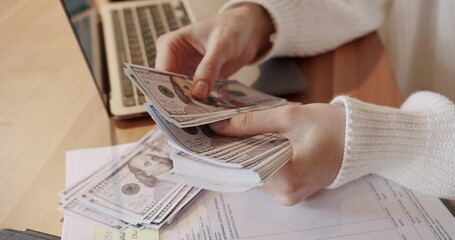 Corrupt money system. Stressed young woman calculating monthly home expenses, taxes, bank account balance and cash payment. Woman counting money on office table. - Powered by Adobe