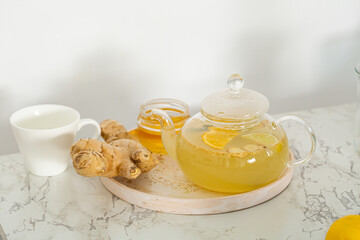 Orange ginger spice tea in glass teapot  food