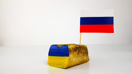 the Russian flag is stuck in the national dish of Ukraine lard. the conflict is military