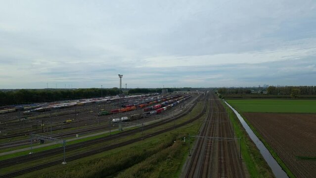 Aerial View Of Kijfhoek Hump Yard With Wagon Parked. Ascending Shot