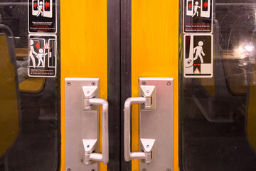 View of the inside of a subway train with the door closed in Brussels