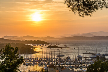 Scenic view of golden summer sunset over the island of Porquerolles in south of France with...