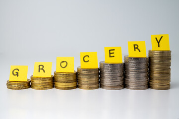 Stacks of coins, and above tickets that spell the word 