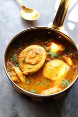 Egg Curry or Anda masala gravy, baida curry. Indian spicy food. Indian nonvegetarian Homemade food. Perfect Indian lunch. over moody background with copy space.