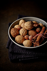 Rustic nuts and cinnamon sticks for Christmas. Close-up