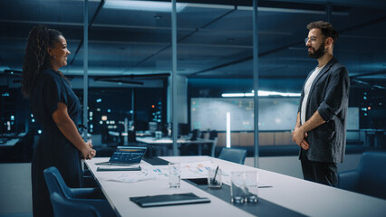 Futuristic Office Online Meeting Video Conference Call: Businesswoman and Businessman Talk using Augmented Reality Software. e-Business For Virtual Work. Ultra Realistic Hologram Concept.