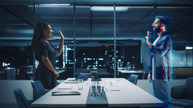 Futuristic Office Remote Meeting: Black Businesswoman Accepts Online Conference Call from Hispanic Businessman. Global e-Business Solutions For Online Distant Work. Unique 3D Hologram Concept