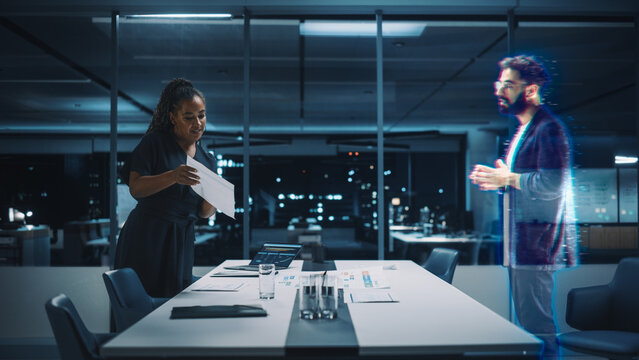 Futuristic Office Online Meeting Video Conference Call: Businesswoman and Businessman Talk using Augmented Reality Metaverse. Global e-Business For Virtual Remote Work. Hologram Simulation.