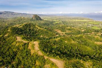 Obraz premium Beautiful morning aerial of the Ilijan Hill and the bohol countryside in the town of Tubigon.