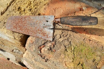 Old rusty bricklayer's trowel for laying bricks