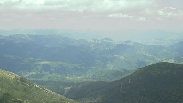 Mountain landscape, green mountains in cloudy weather. Mountains before the rain. Ukrainian Carpathian Mountains. A distant mountain range. Heavy clouds. Peace at the top. High quality 4k footage
