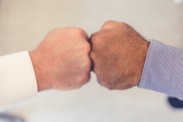 Diversity, collaboration and goals with two of employees in trust, success and vision. Closeup shot...