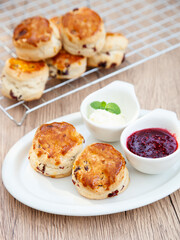 Cranberry scone set with raspberry jam and clotted cream