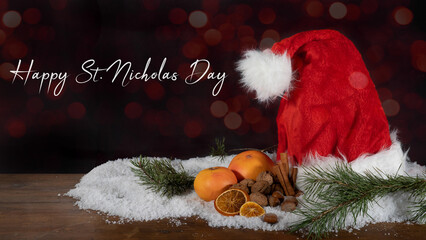 Saint Nicholas Day Christmas celebration holiday banner greeting card - Santa Claus cap, oranges,...