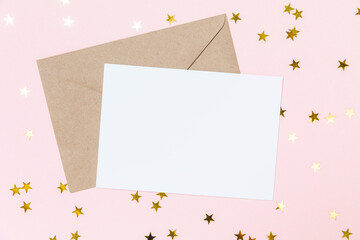 Festive greeting card with envelope template with confetti stars on pastel pink background....