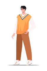 A young serious concentrated  intelligent Asian guy with glasses and a yellow vest. Business  creative occupation person.