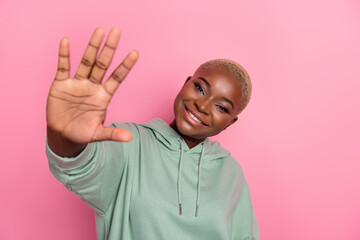 Portrait of young good mood attractive female meet her best friend say hello give high five isolated on pink color background © deagreez