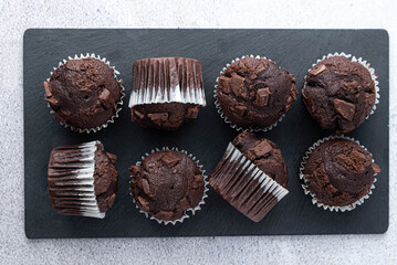 Chocolate muffins on a dark background.