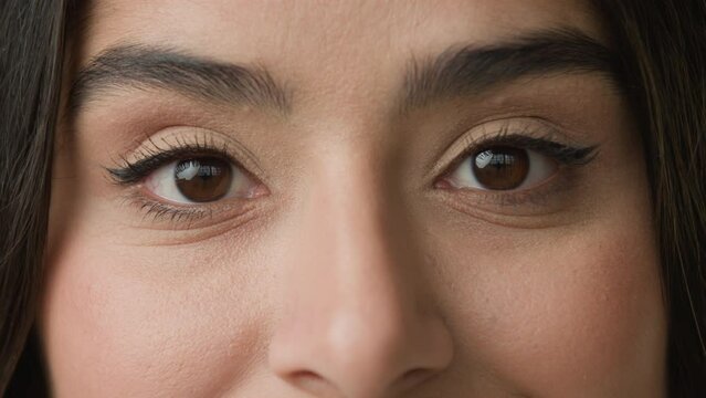 Close up female dark black eyes with natural make-up eyeliner on eyelid long eyelashes looks at camera cataract laser vision correction wisdom unrecognizable woman girl lady look see eyesight health