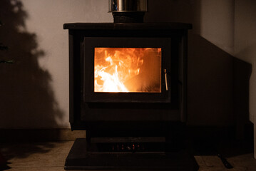 Old fashioned fireplace in dark room