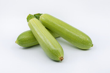 Ripe and Fresh Zucchini on isolated white background.
Zucchini or Cabbage Vegetables on white.