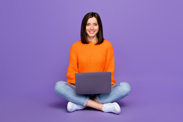 Full size photo of pretty young girl sit floor remote manager netbook wear trendy orange knitwear...