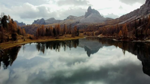 Magical autumn in the Dolomites. Enchanting colors of Lake Federa from above
