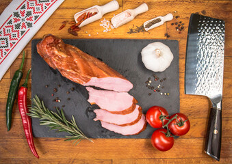 ordinary organized table to be served. Food tray with scrumptious portions of cold cuts, tomatoes...