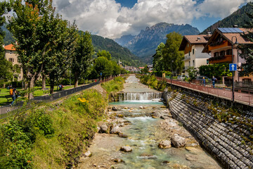 Fototapeta na wymiar River view of Fiera di Primiero.August 2022 Fiera Di Primiero, Trentino Alto Adige - Italy