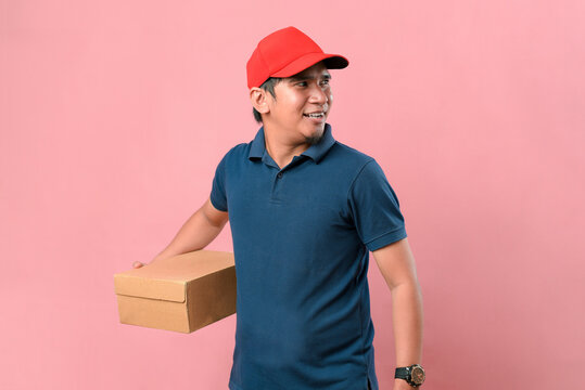 Asian Delivery Man Holding A Parcel Box Look Away