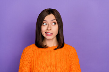 Portrait of minded clueless person grin teeth look empty space contemplate isolated on purple color background