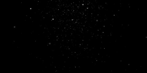 Snowfall background. White snow on a black sky. Winter background. Christmas background concept. Large flakes of snow slowly fall down.