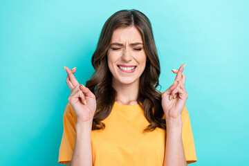 Photo of young funny excited crazy cute nervous pretty woman wear yellow t-shirt bite lips worried...