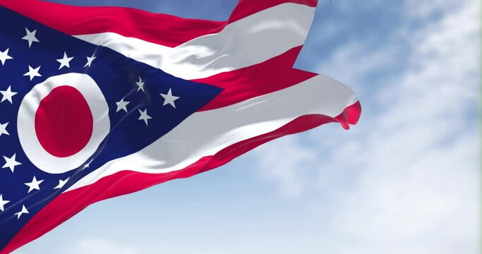The Ohio state flag waving in the wind on a clear day