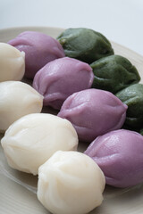 Delicious-looking three-color honey rice cakes served in a bowl