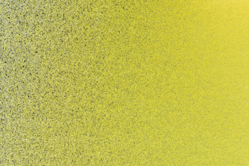 Fototapeta premium macro photography of black and yellow spray paint on white paper