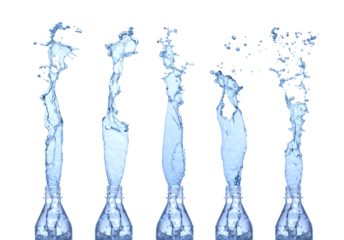 Water splashes from a bottles. Isolated on white