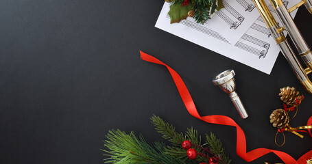 Christmas performance of brass instruments with mouthpiece and sheet - obrazy, fototapety, plakaty