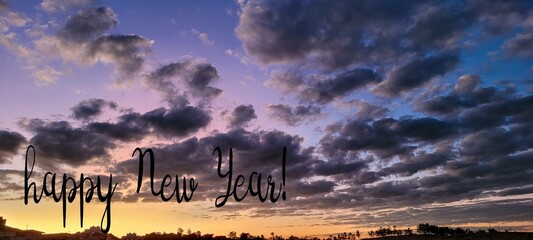 sky with clouds and a happy new year