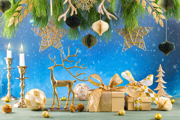 Christmas or New Year festive composition. Fir branches, candles, gold Christmas decorations,balls,...