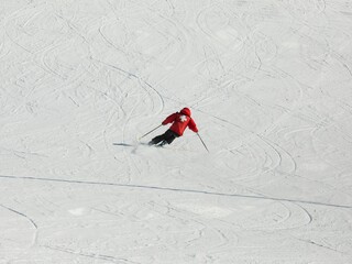 ski patroller carving turns at a resort