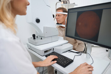 Fototapeta na wymiar Close-up photo of ophthalmologist testing patient eyes