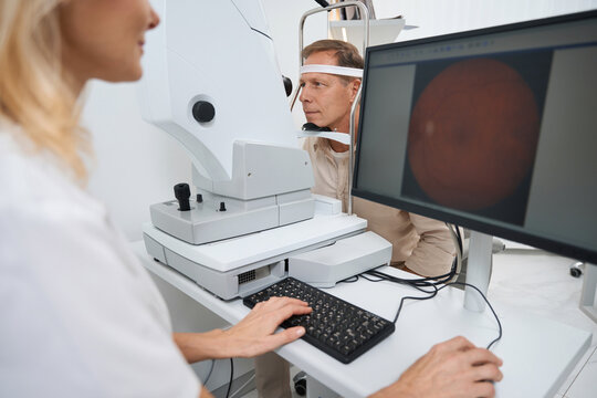 Close-up photo of ophthalmologist testing patient eyes