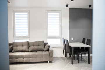 interior of modern room with chairs, sofa and furniture.