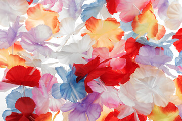 Colorful plastic hawaii flowers. Colorful background