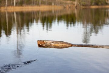 Row boat scull in use in calm day in Finland